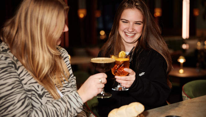 two friends toasting